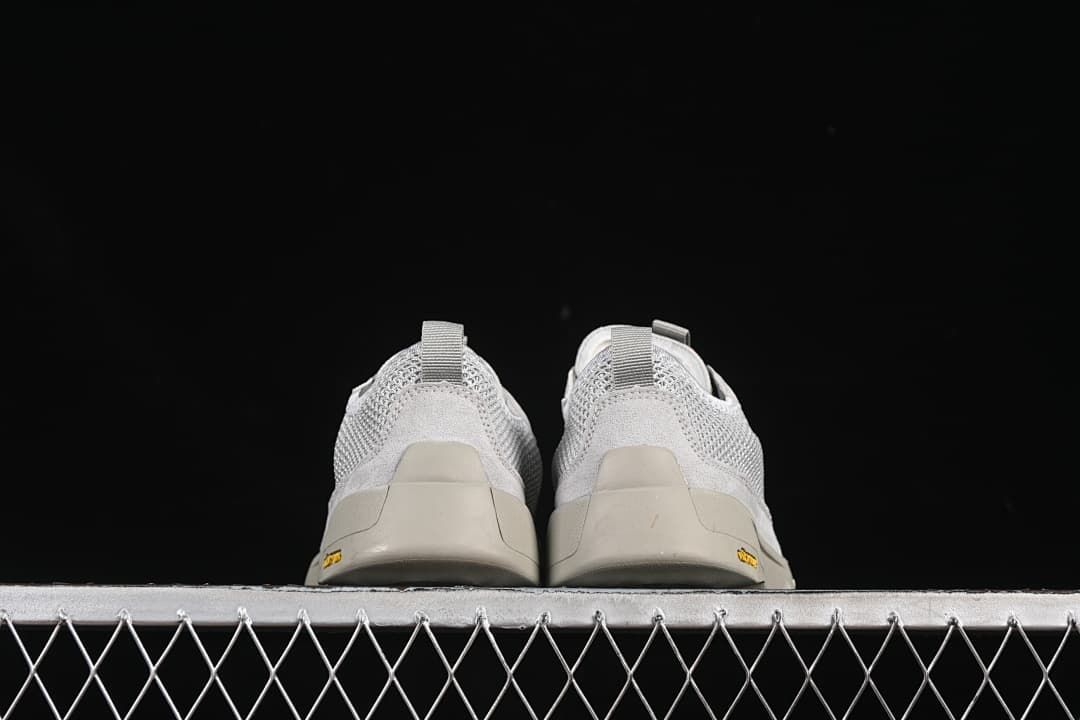 Rear view of the pair showing heel pull tabs and outsole edges.
