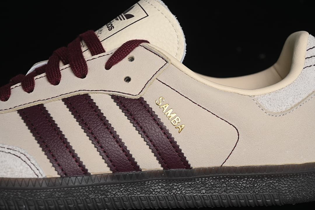 Close-up of burgundy side stripes and Samba lettering on the cream upper.