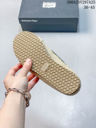Underside view showing the sneaker’s patterned rubber outsole.