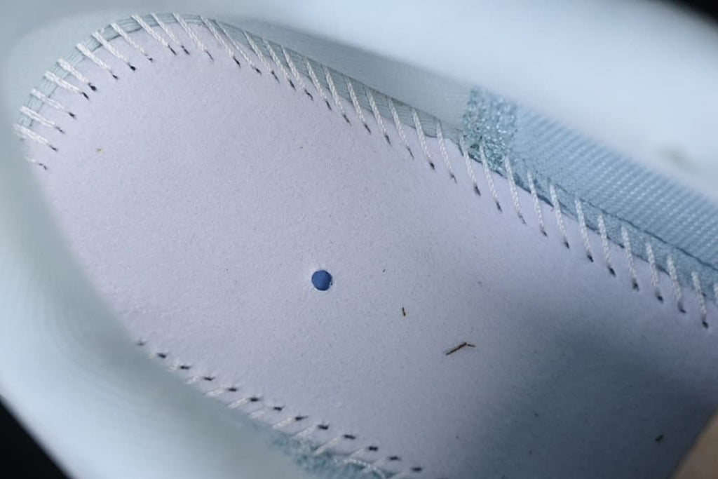 Close-up of stitching inside the running shoe.