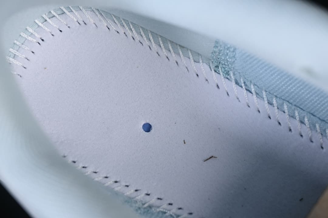 Close-up of stitching inside the running shoe.