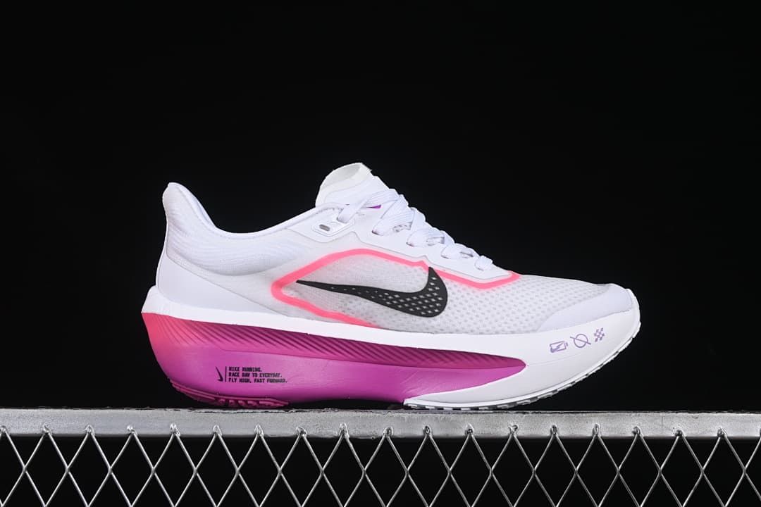 Side view highlighting the black Swoosh and pink-purple sole