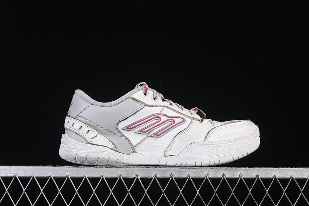 Side profile highlighting the low-top silhouette and layered panels