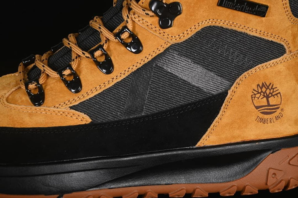 Close-up of the boot side panels, laces, hooks, and Timberland logo