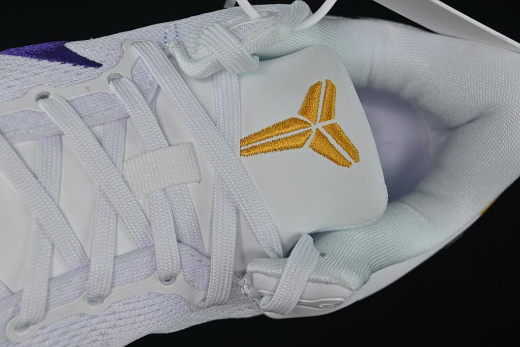 Close-up of laces and gold Kobe emblem on the tongue