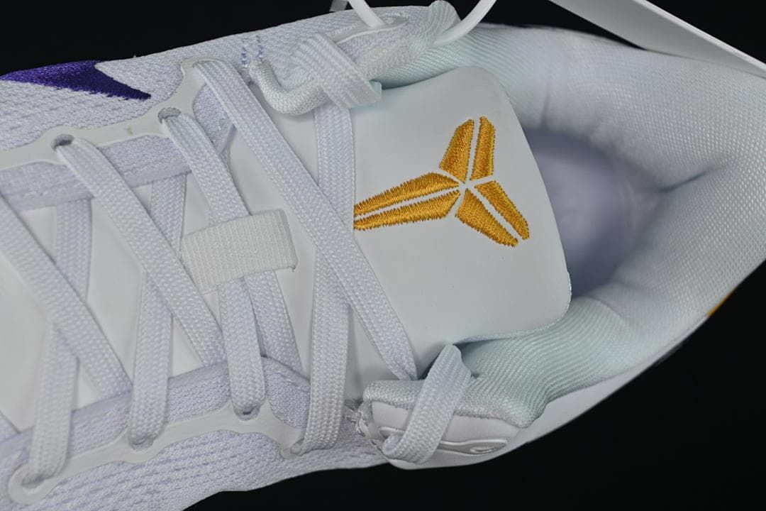 Close-up of laces and gold Kobe emblem on the tongue