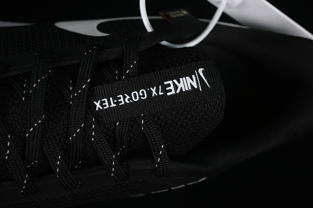 Close-up of tongue branding and black laces