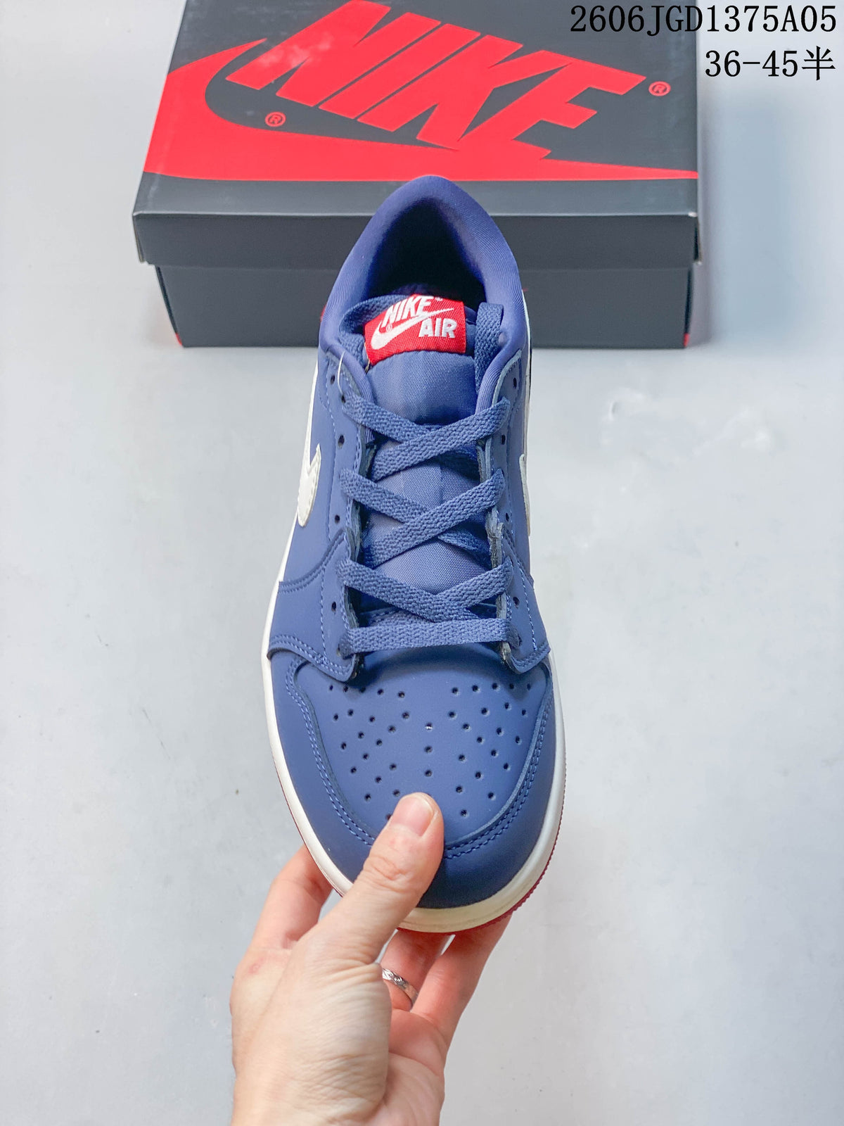 Top view showing the perforated toe, blue laces, and red tongue label