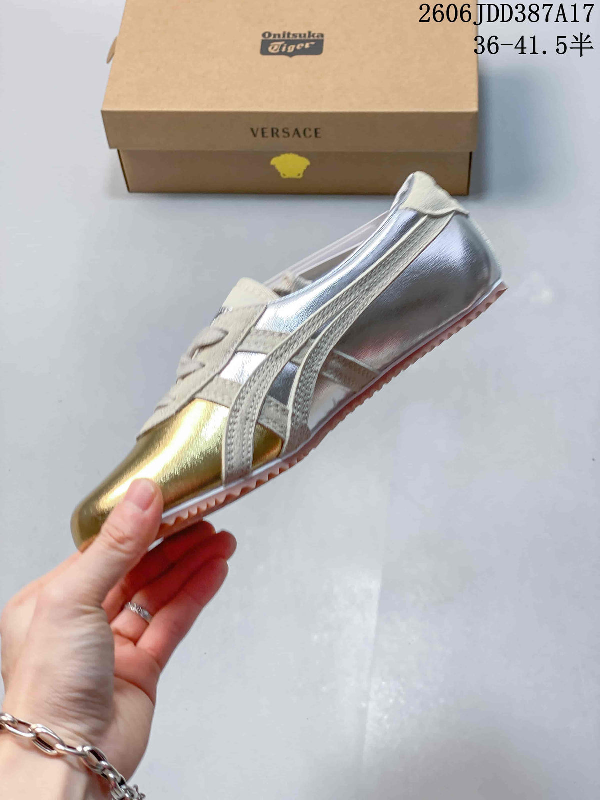 Side view of the gold- and silver-tone low-top sneaker