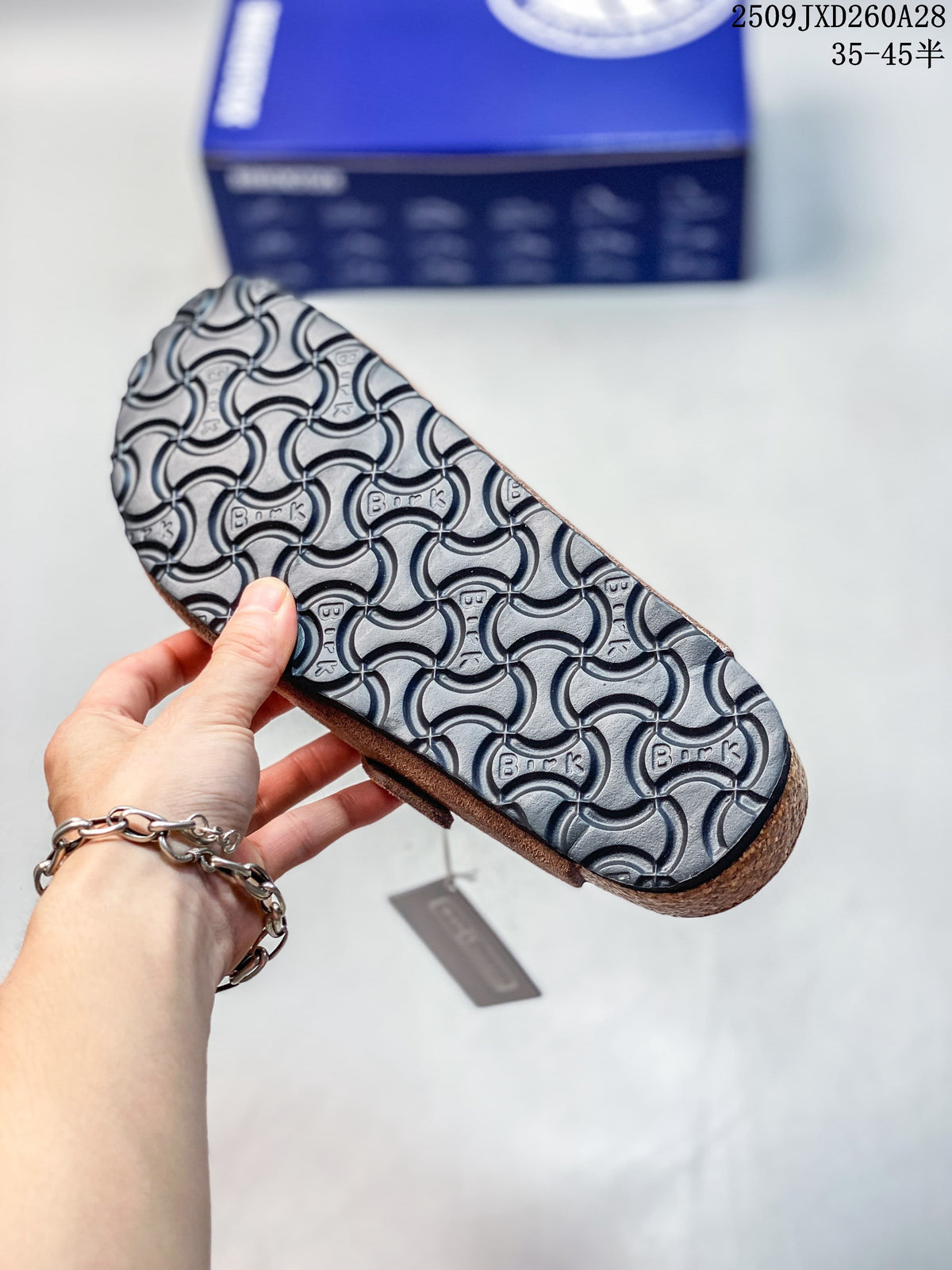 Textured outsole of the brown mule