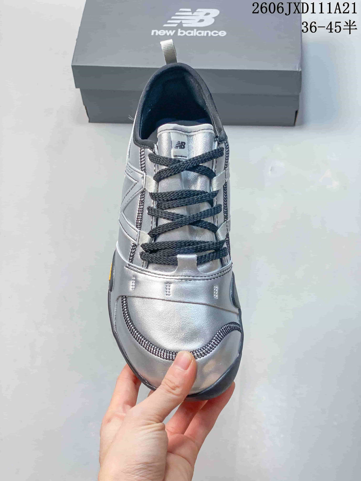 Top view showing the sneaker's dark laces and silver-toned upper