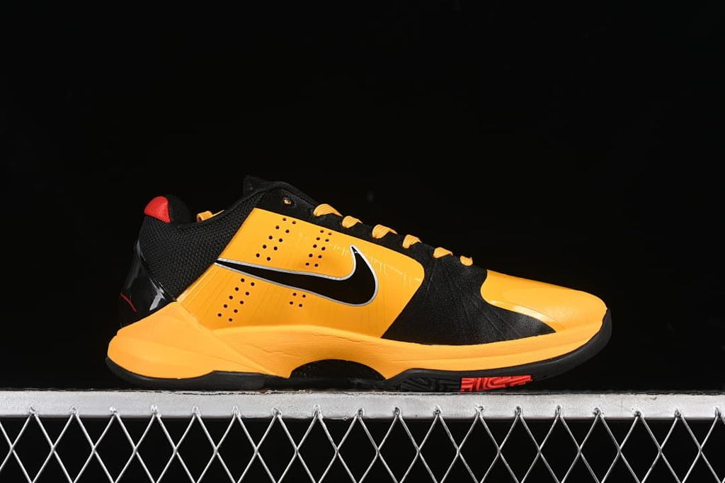 Side profile of a yellow and black Kobe 5 basketball shoe