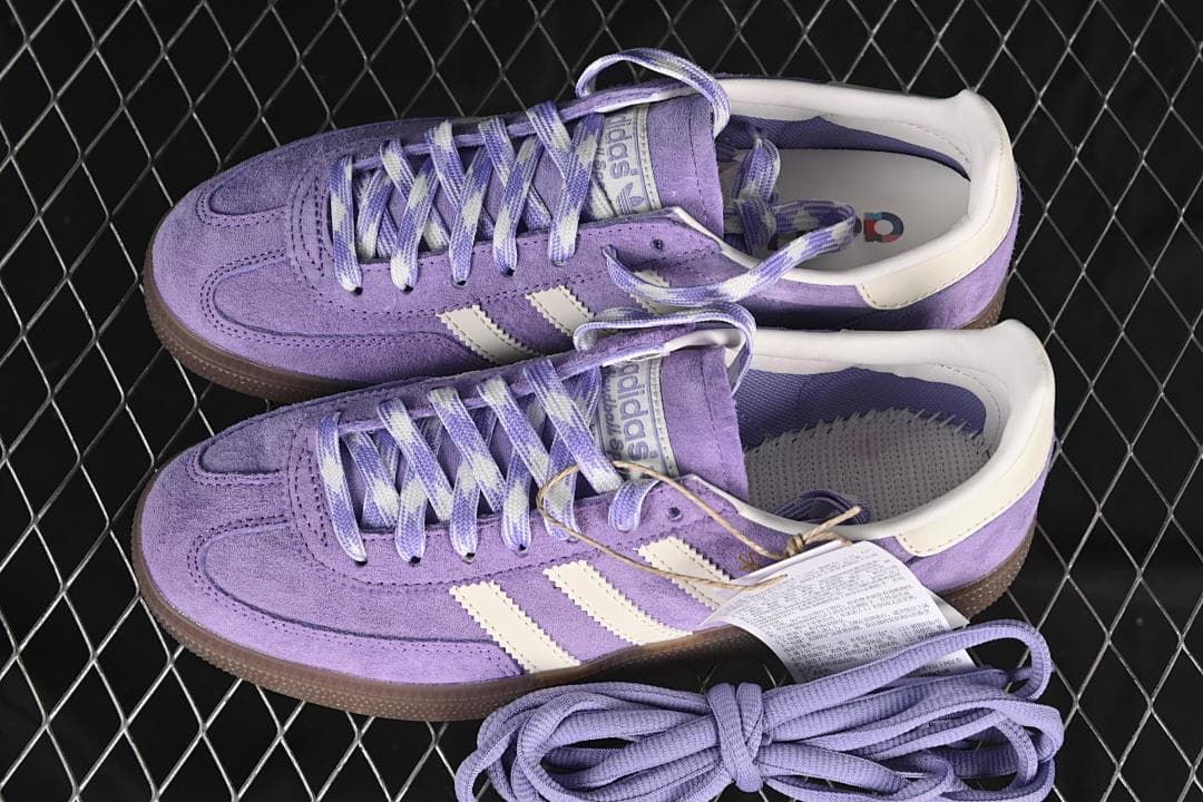 Pair of purple Handball Spezial sneakers with an extra set of laces