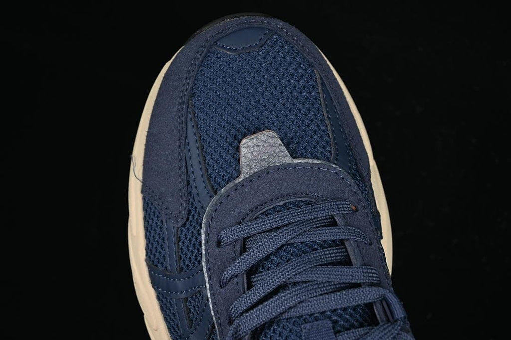 Top view of the sneaker toe, mesh panels, and laces