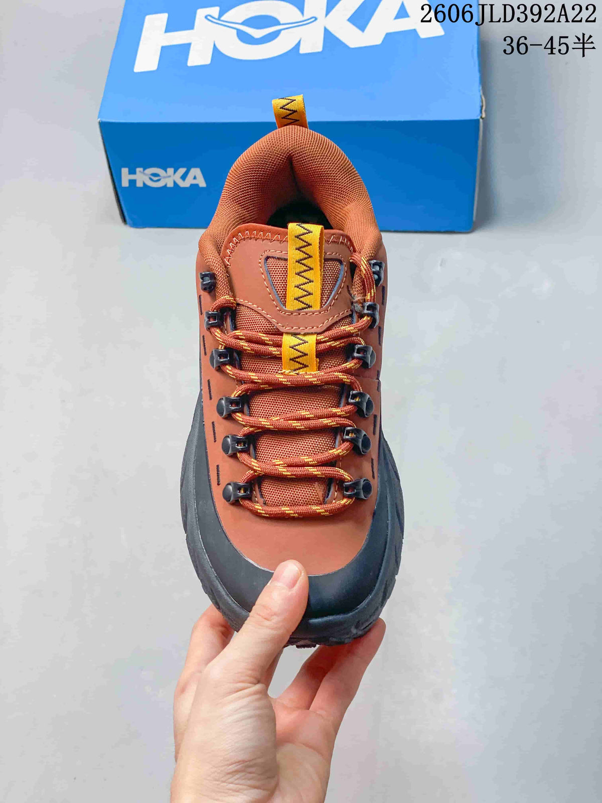 Top view showing the laces, metal-look hooks, and contrasting pull tabs