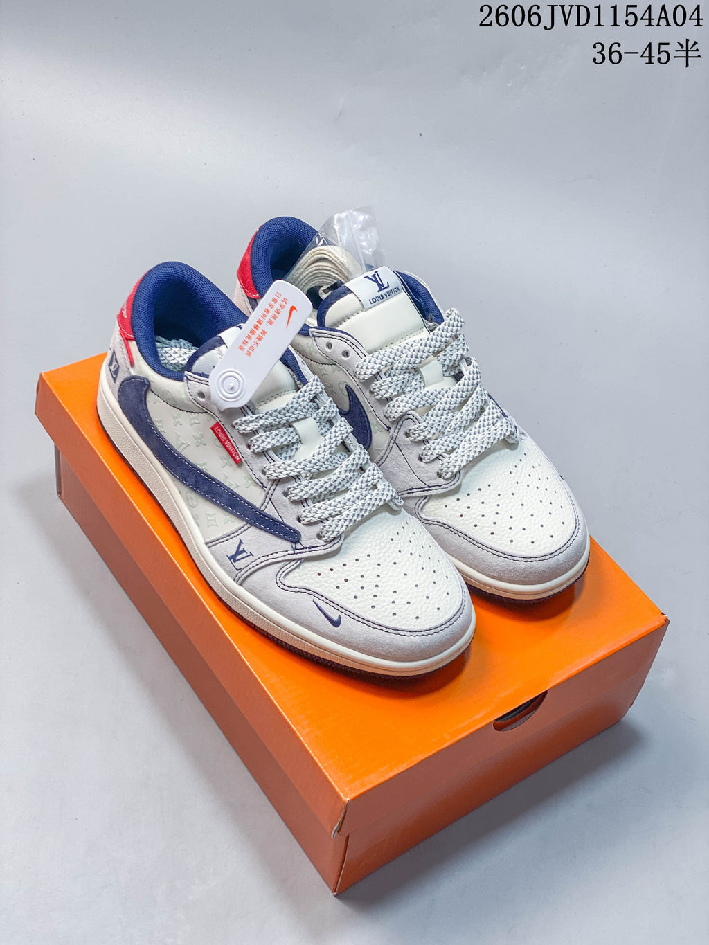 White and blue low-top sneakers with red heel accents displayed on an orange box.