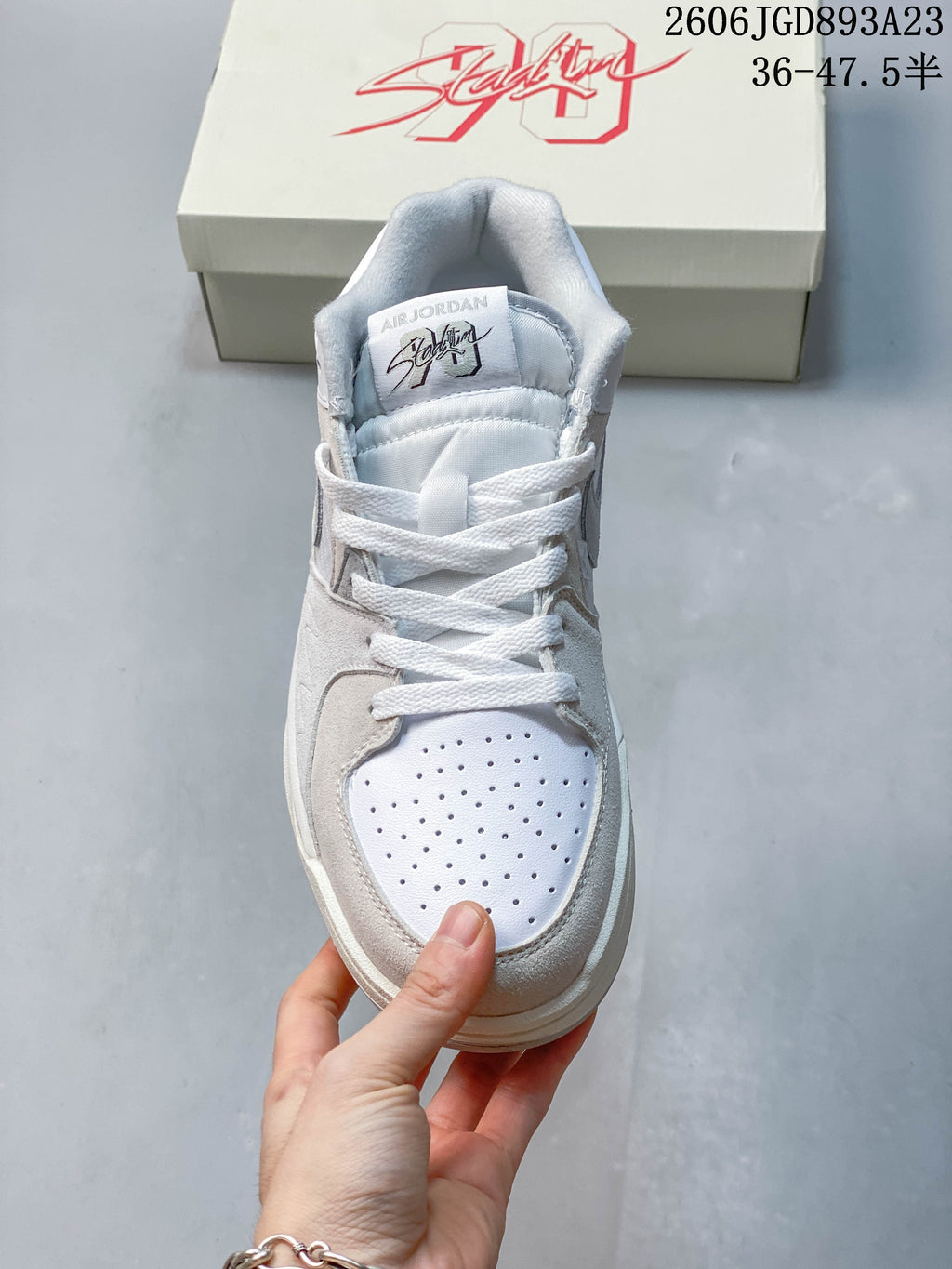 Top view of the sneaker showing the perforated toe and laces