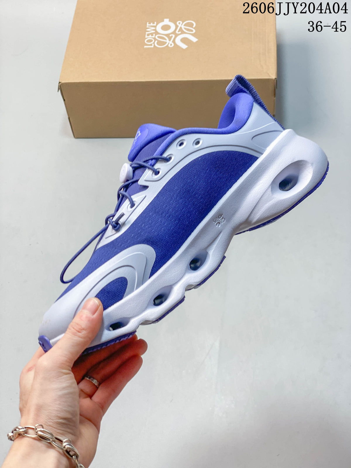 Side view of the blue-and-white sneaker and sculpted sole.