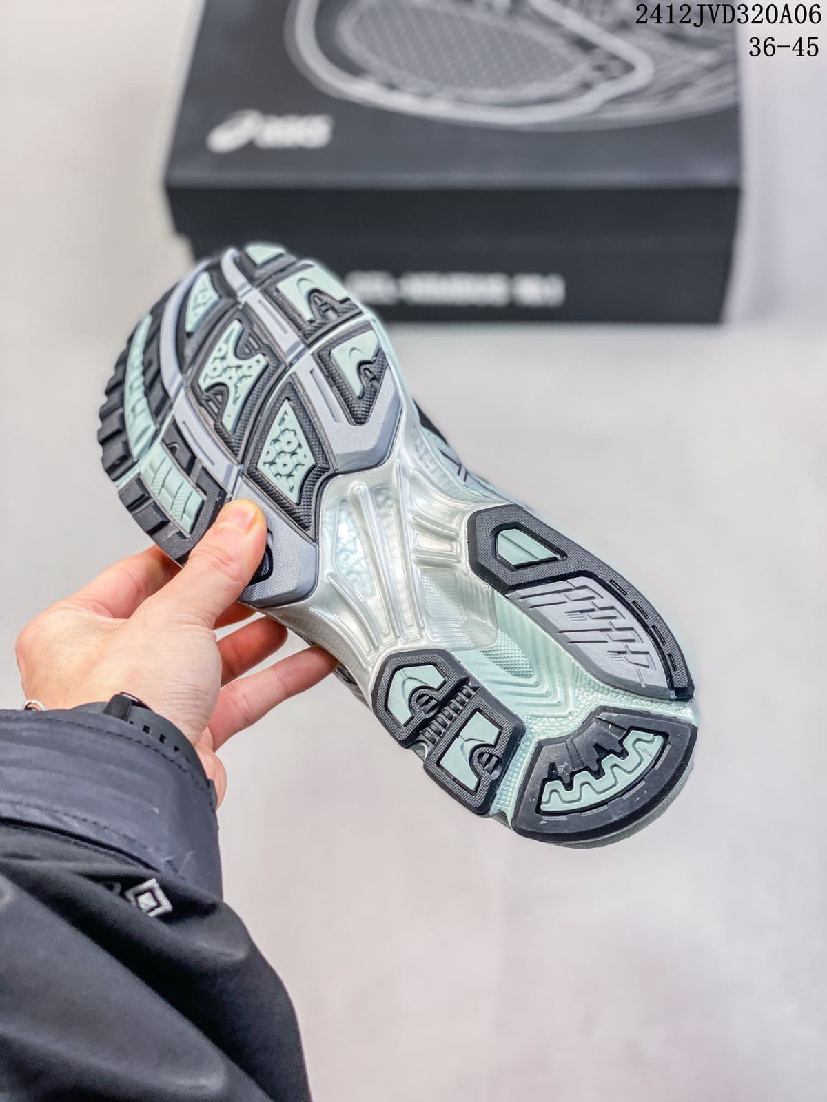 Underside of an ASICS Gel-Nimbus 10.1 sneaker showing its segmented tread and sculpted sole.