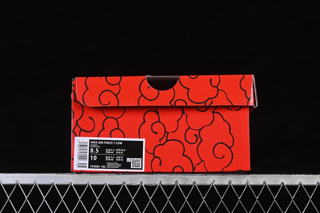Red patterned shoe box with a label showing the Air Force 1 model and sample sizing