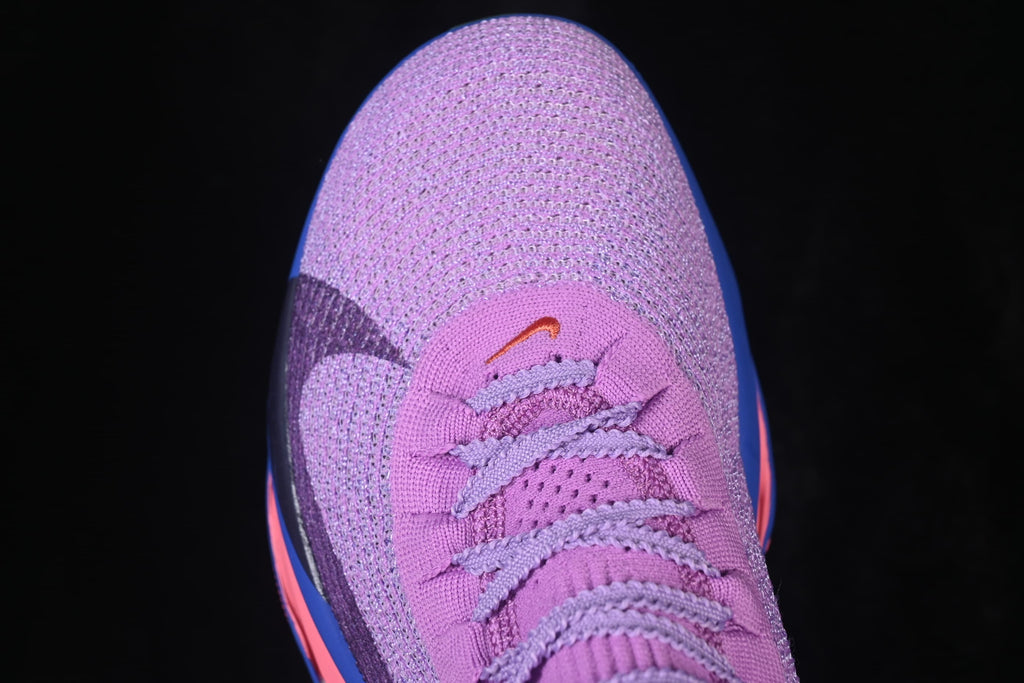 Top view of the purple shoe toe and lace area.