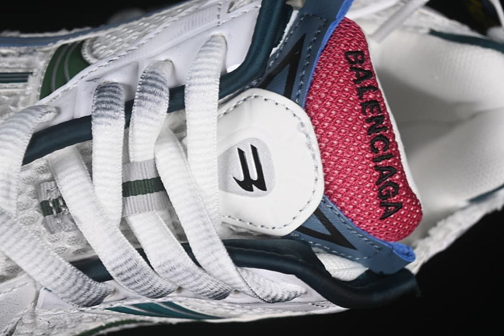 Close-up of the laces, tongue, and pink tongue panel
