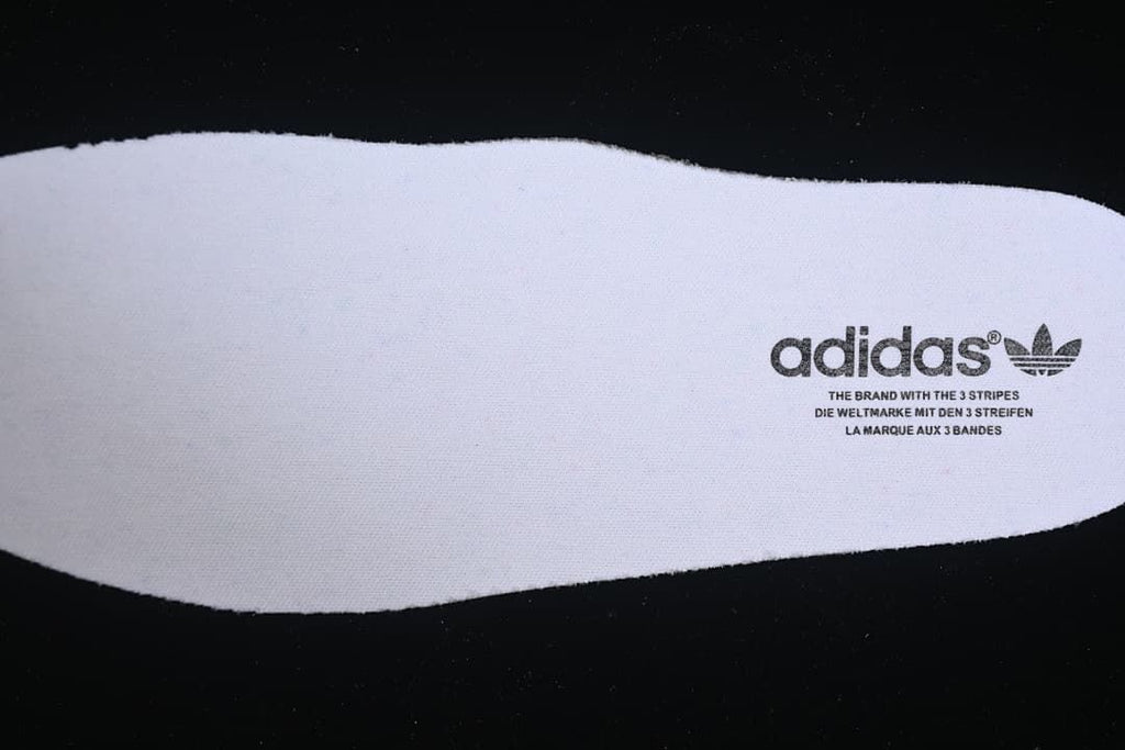 White sneaker insole with adidas branding