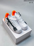 Pair of white low-top sneakers with orange heels and black side zipper detailing