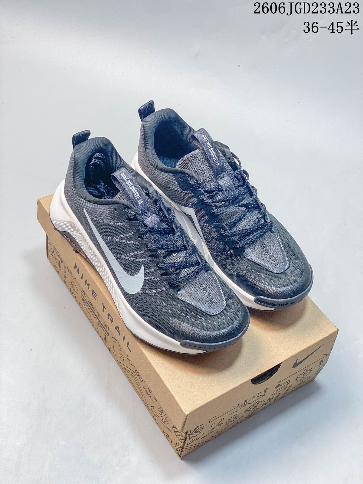 Pair of gray Nike Wildhorse 10 trail shoes with white accents on a Nike Trail box