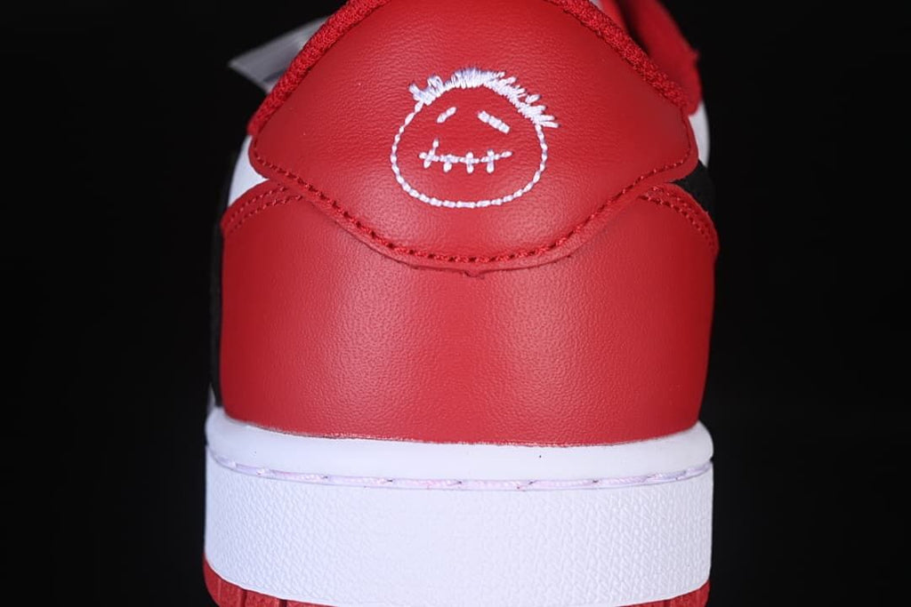 Rear view of the red heel with white embroidered graphic.