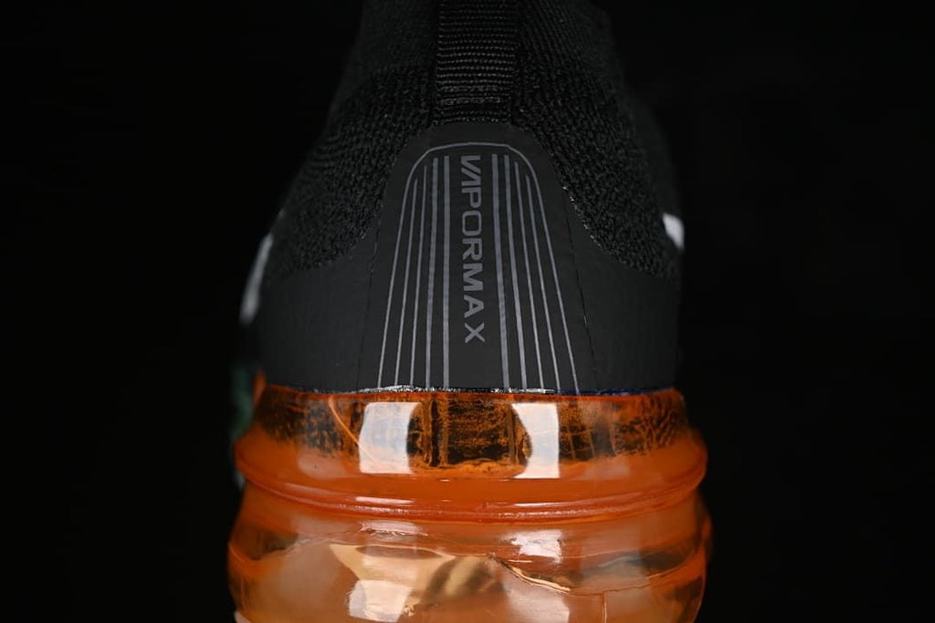Rear close-up of the VaporMax heel and orange transparent sole.