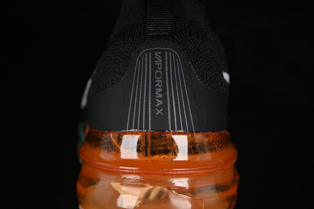 Rear close-up of the VaporMax heel and orange transparent sole.