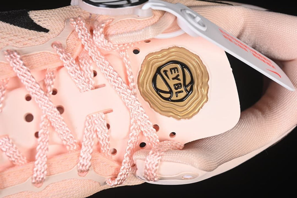 Close-up of laces and a gold-colored tongue badge