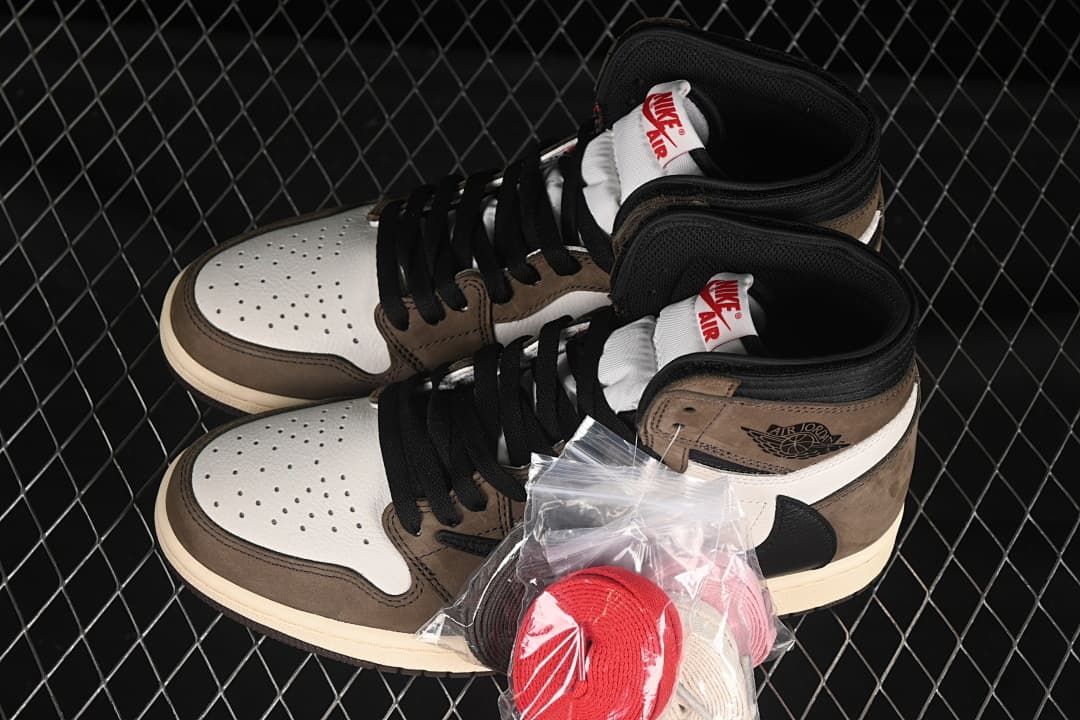 Pair of brown, white, and black high-tops with extra laces in a packet