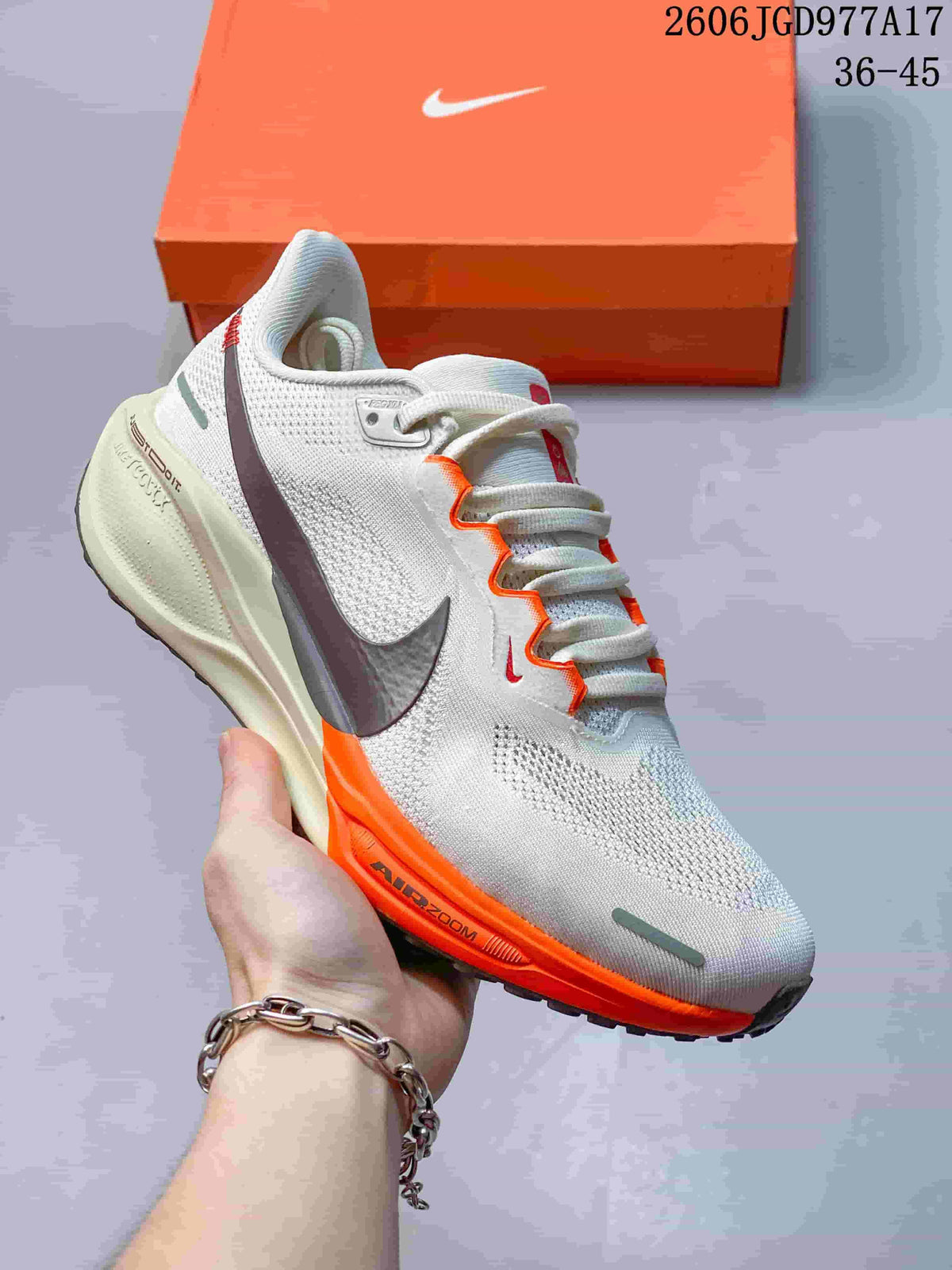 Side view of a light Pegasus 41 shoe with orange trim, dark Swoosh and Air Zoom midsole lettering