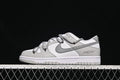 Side view of a white and grey low-top Dunk sneaker with cord-style lacing