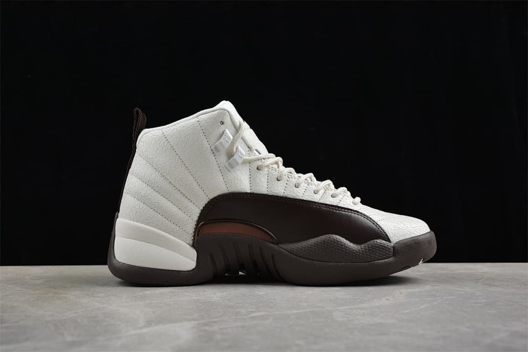 Side profile of the Air Jordan 12 in sail white with a dark brown mudguard and sole