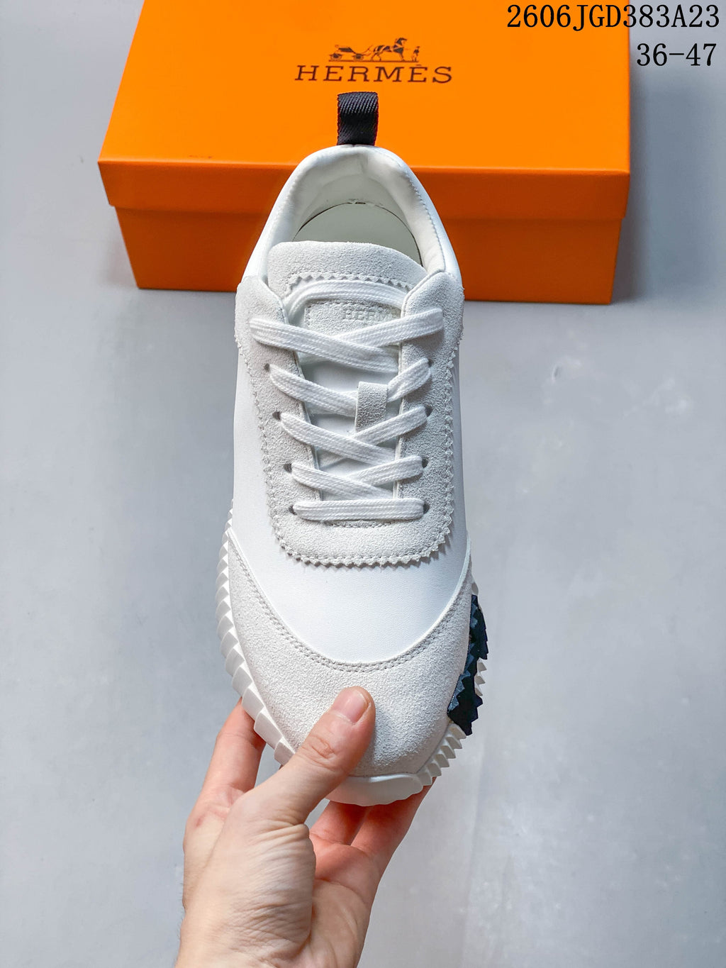Top view of the sneaker showing white laces and textured gray overlays.