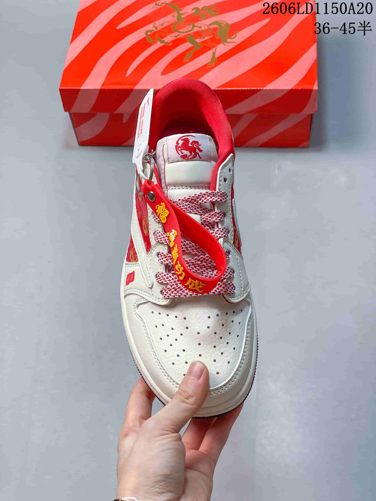 Top view showing the perforated toe, patterned laces, and red collar lining