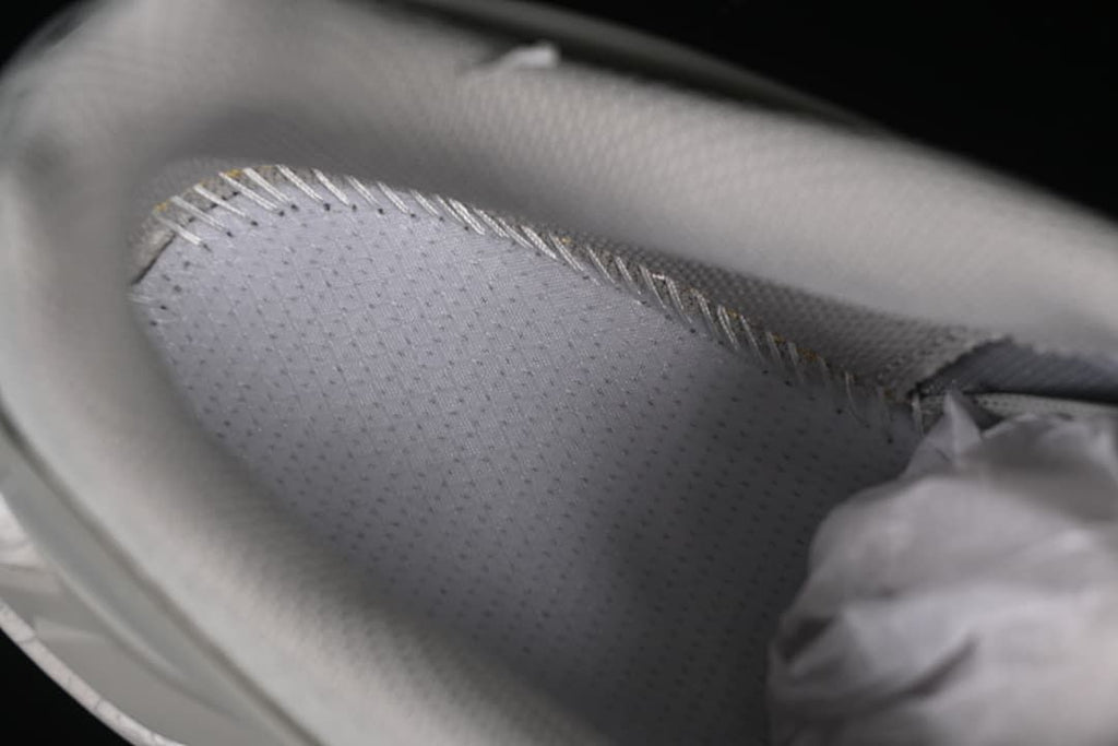 Close-up view inside the shoe showing its lining and interior stitching