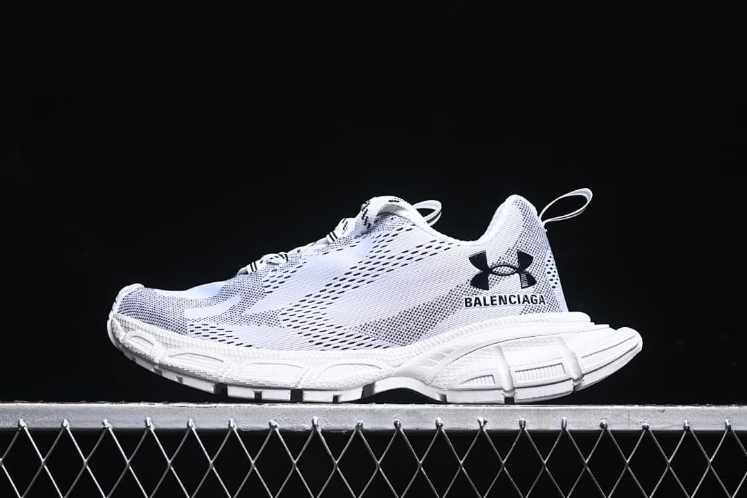 Side view of a white and black sneaker with a chunky sole.