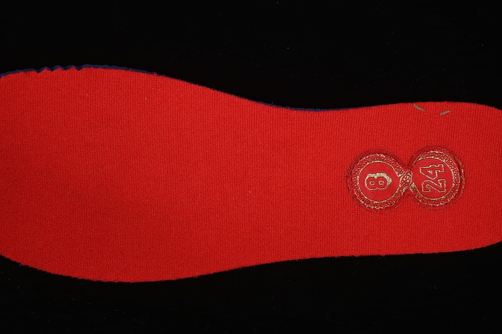 Red insole detail with an embroidered number eight and 24 emblem