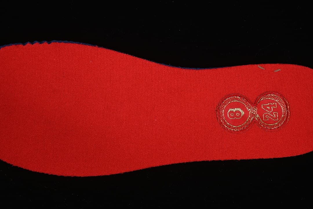 Red insole detail with an embroidered number eight and 24 emblem