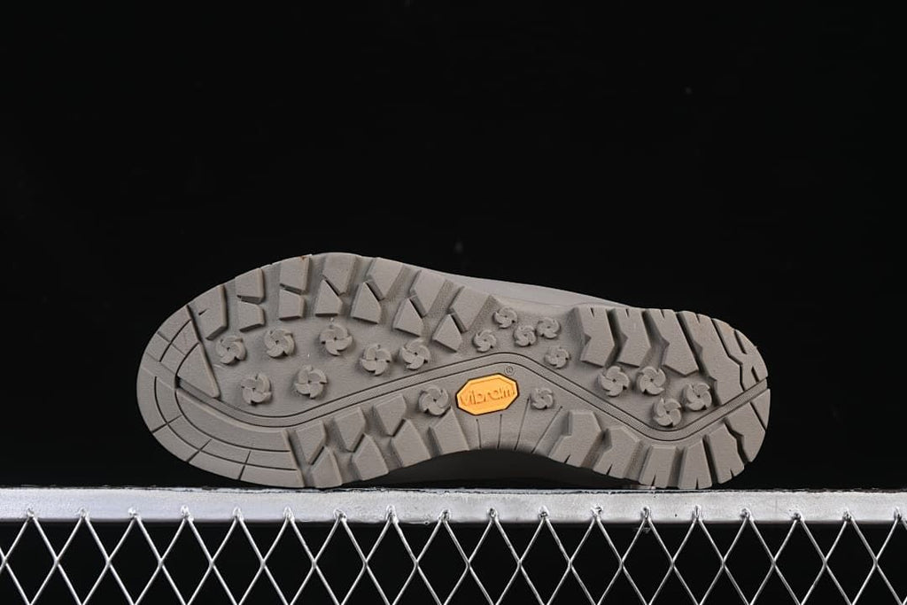 Underside showing the lugged outsole and Vibram branding