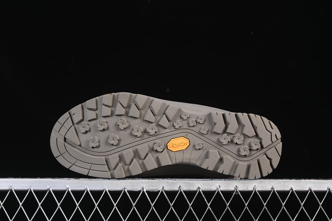 Underside showing the lugged outsole and Vibram branding
