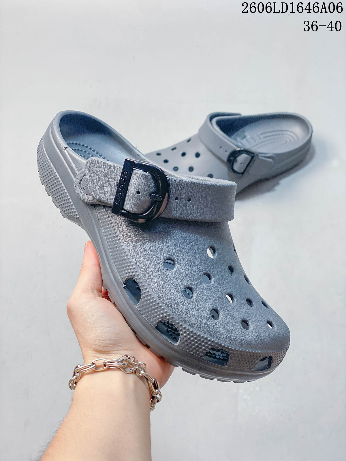 Close view of a gray clog with a strap buckle and ventilation holes; image also displays size range 36–40.