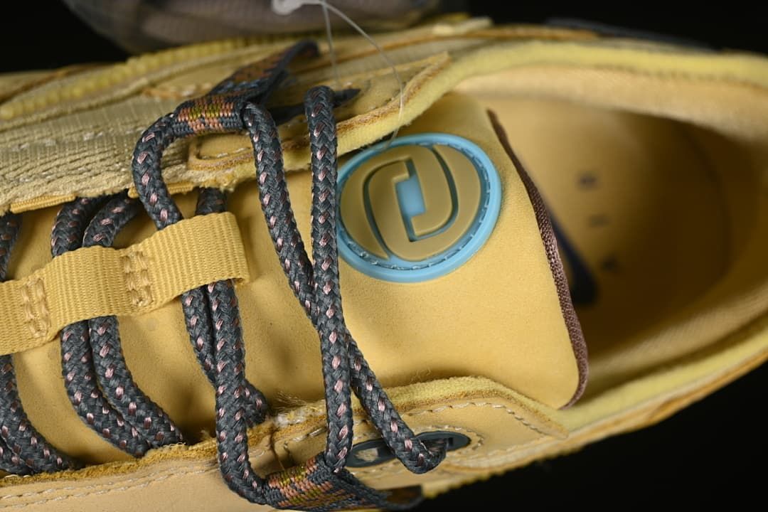 Detail of the tongue’s circular accent and patterned laces.