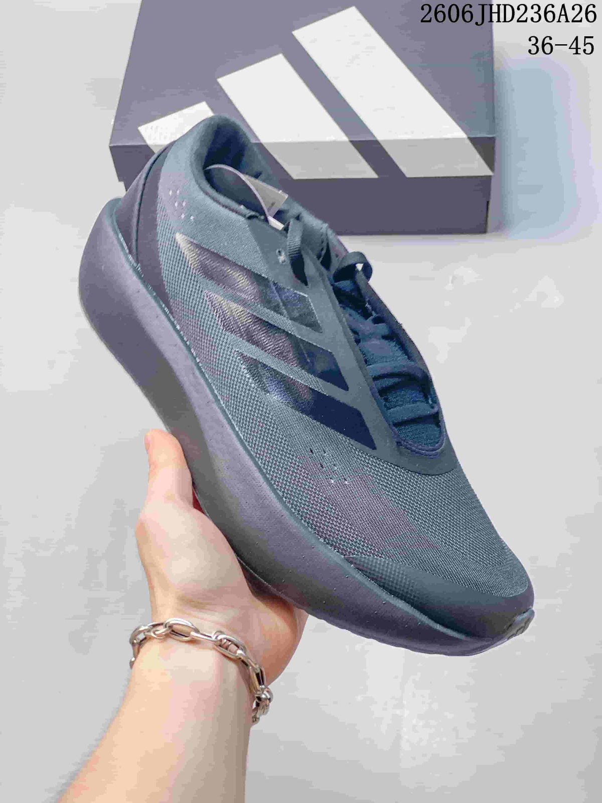 Close-up side view of a dark gray adidas ZENBOOST shoe.