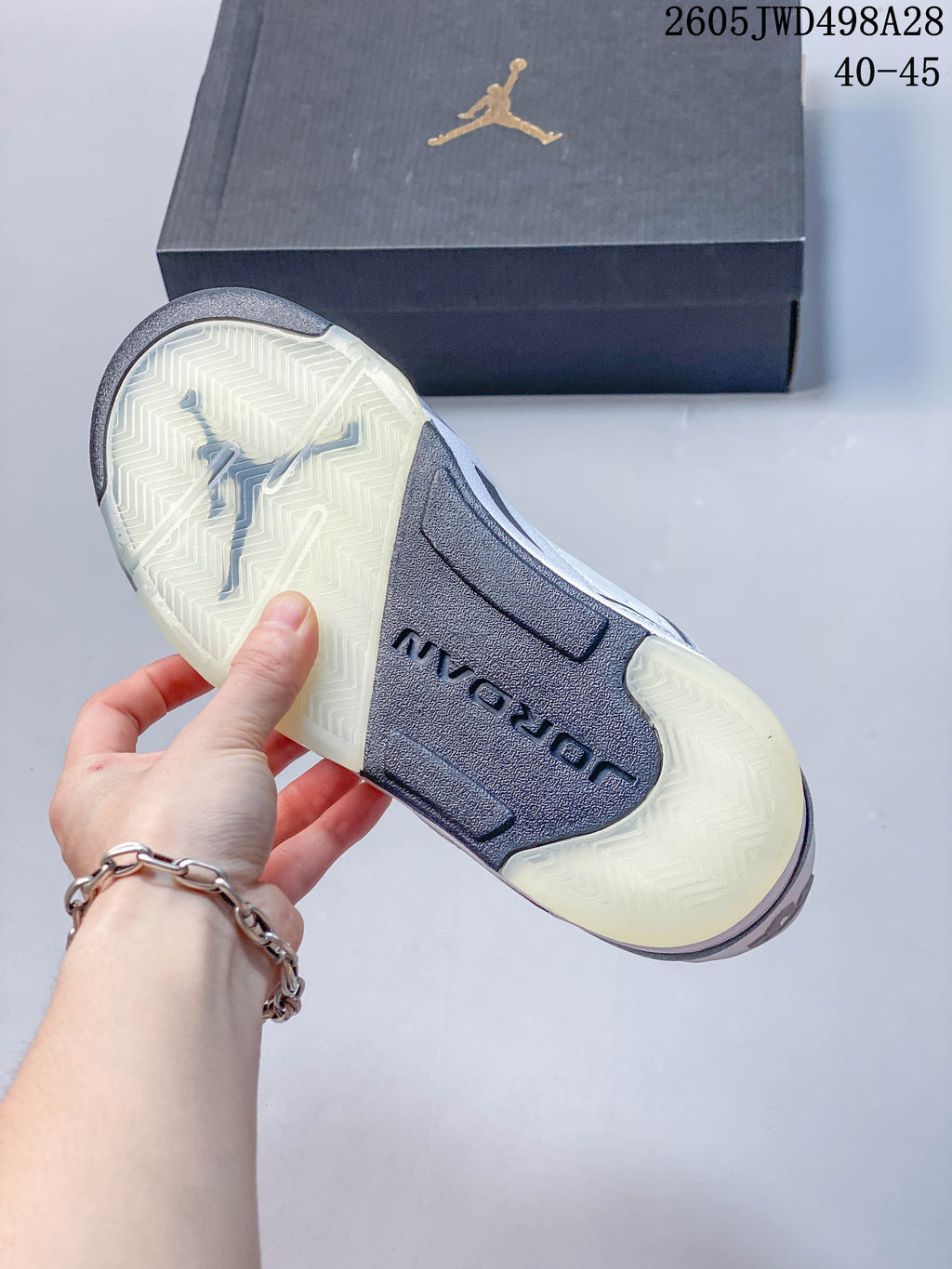 Close-up of the sneaker outsole with translucent sections and a dark central panel.