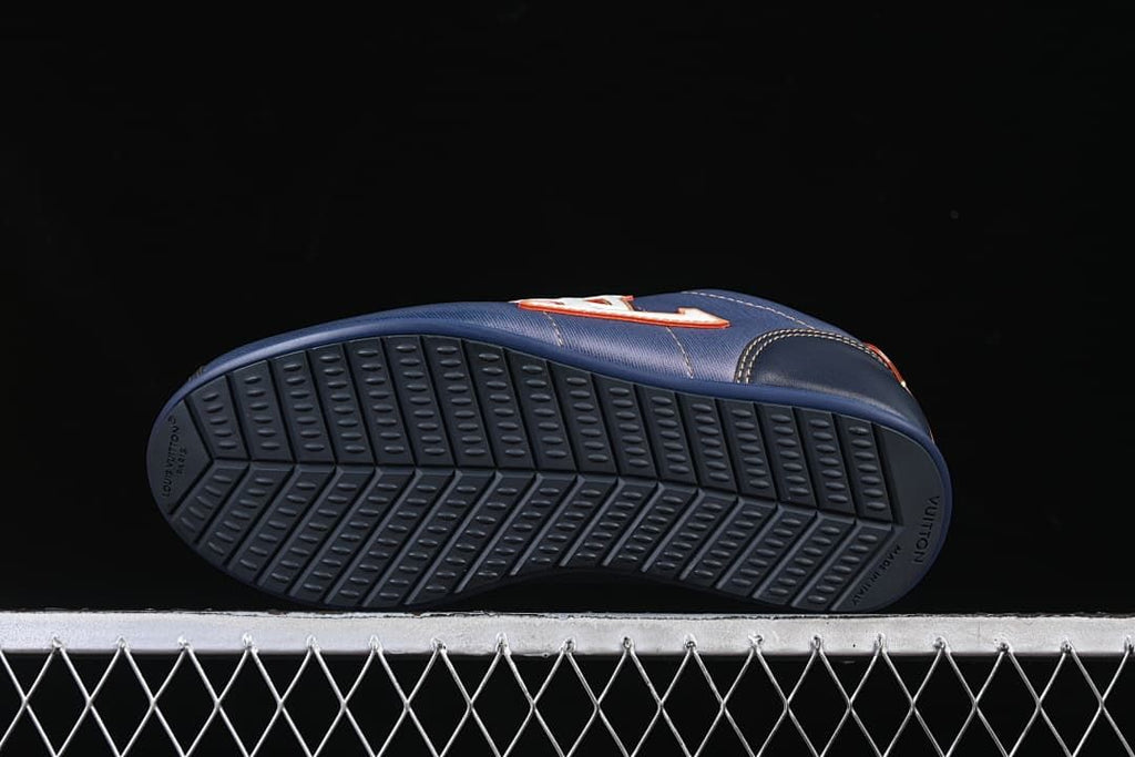 Underside view showing the patterned dark blue outsoles